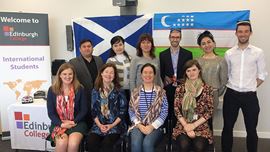 Edinburgh College International team and representatives from Uzbekistan posing for a photo.