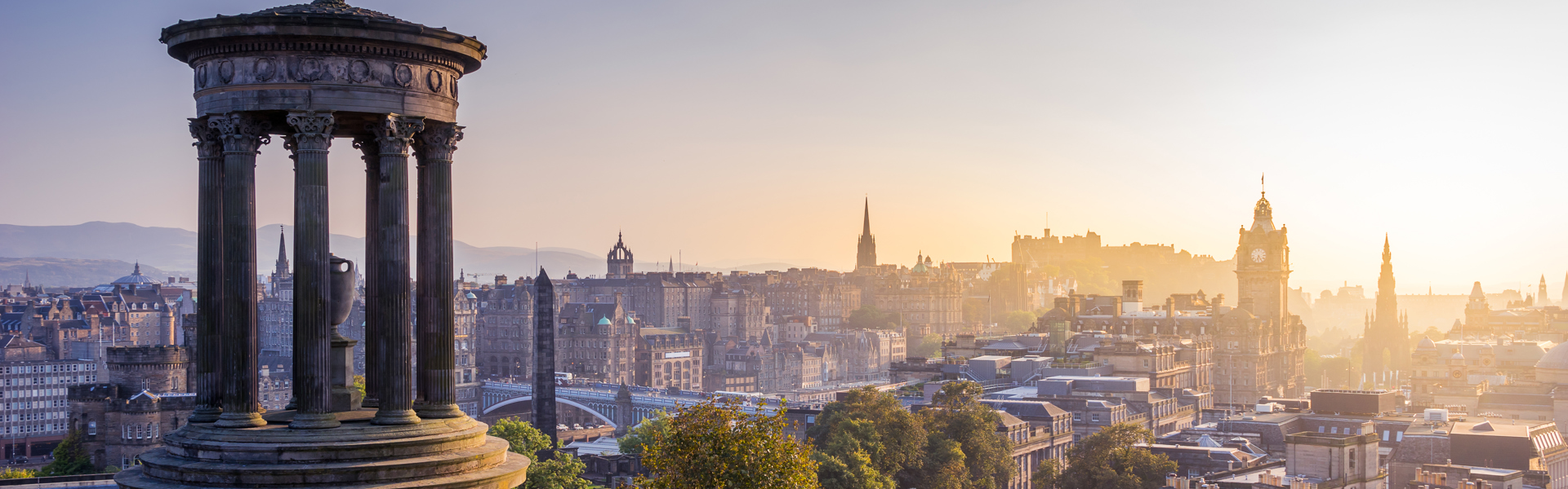 Edinburgh skyline from Calton Hill at sunset.