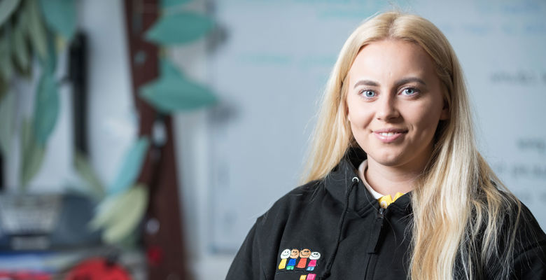 Childhood practice smiling in their classroom.
