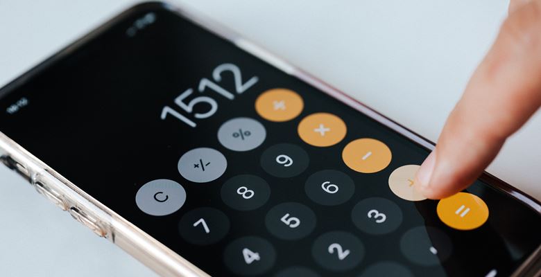 Smartphone calculator on a desk.